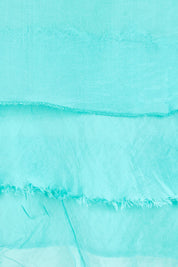 Product shot of the Silk Blend Three Layer Raw Edge Top - Acqua in colour Acqua, showing detail