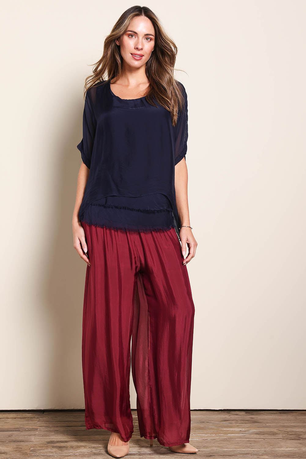 Model Maddiec wearing size 10 of the Silk Blend Three Layer Raw Edge Top - Navy in colour Navy, from the front