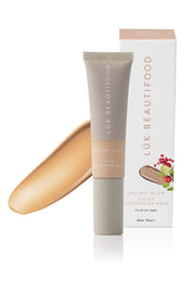 Product shot of the Tinted Complexion Balm in colour Medium, from the front