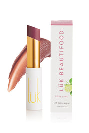 A model wearing the Rose Lime Lip Nourish in colour Rose (Pink), from the front, showing the whole outfit