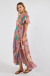 Model Genericm wearing size sample of the Algarve Wrap Dress – Violet in colour Violet, from the front
