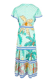 Product shot of the Aquila Maxi Dress in colour Mist (Green), from the back