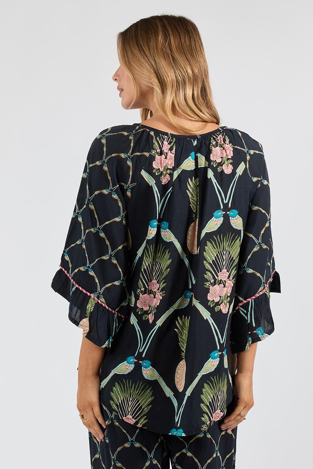 Model Genericm wearing size sample of the Beaumont Top – Navy in colour Navy, from the back