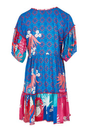 Product shot of the Busena Dress in colour Ocean, from the back