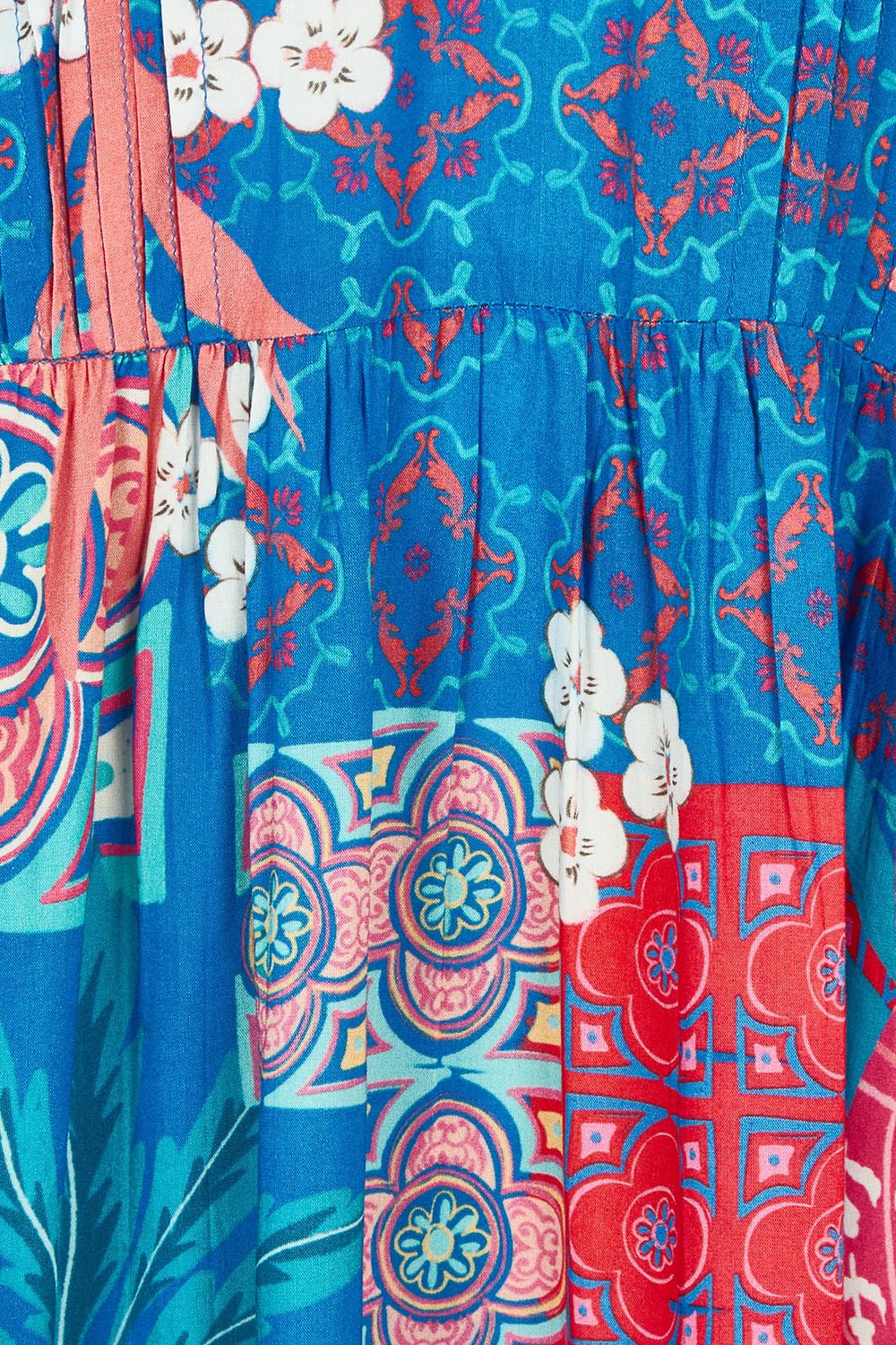 Product shot of the Busena Dress in colour Ocean, detail