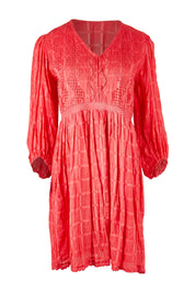 Product shot of the Byron Dress in colour Melon (Pink), from the front