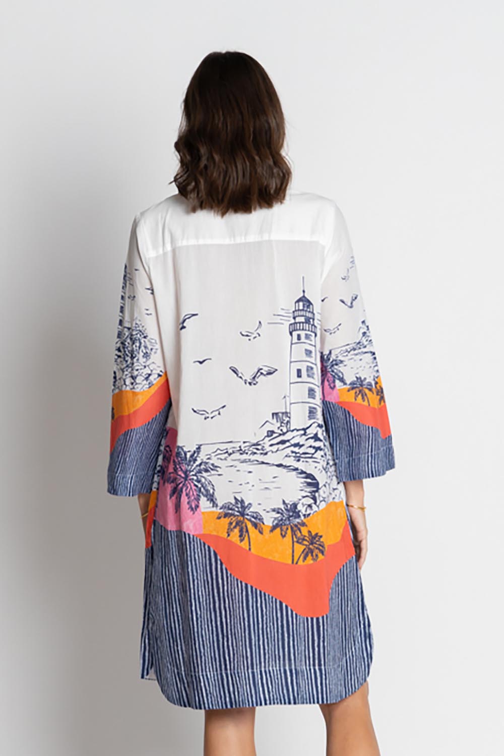 A model wearing the Byron Cotton Shirtmaker Dress in colour Print, from the back