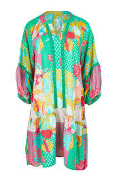 Product shot of the Camargue Dress in colour Lagoon (Green), from the front