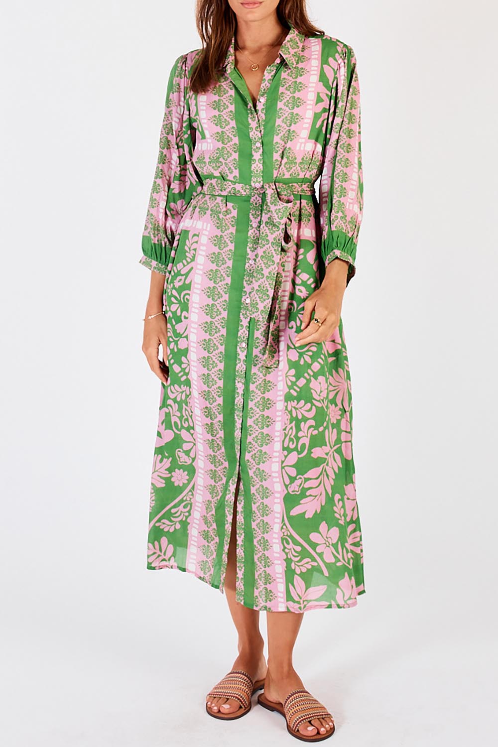 A model wearing the Carara Buttoned Midi in colour Green (Green), from the front, cropped image