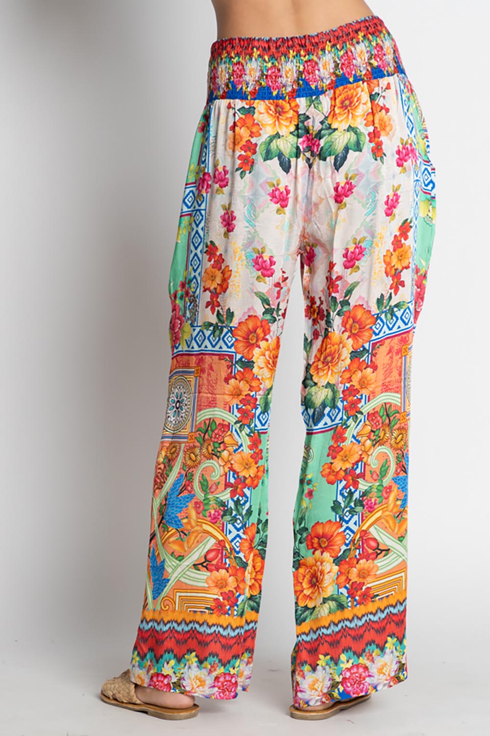 A model wearing the Carlisle Pant in colour Print, from the back