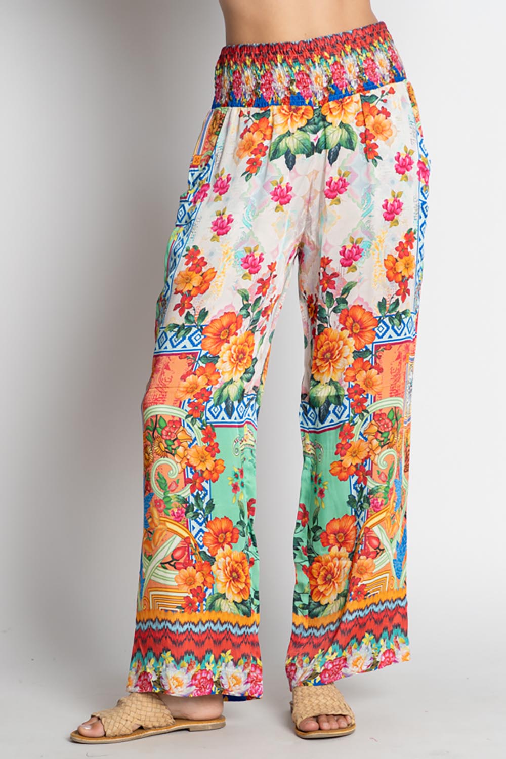A model wearing the Carlisle Pant in colour Print, from the front, cropped image