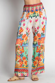 A model wearing the Carlisle Pant in colour Print, from the front, cropped image