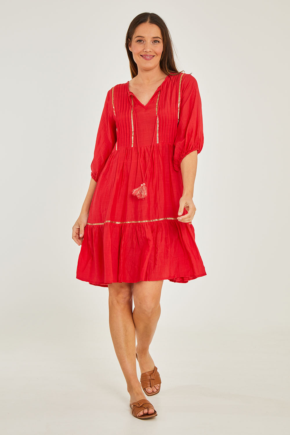 Model Georgia wearing size S of the Delilah Dress in colour Melon (Pink), from the front, showing the whole outfit