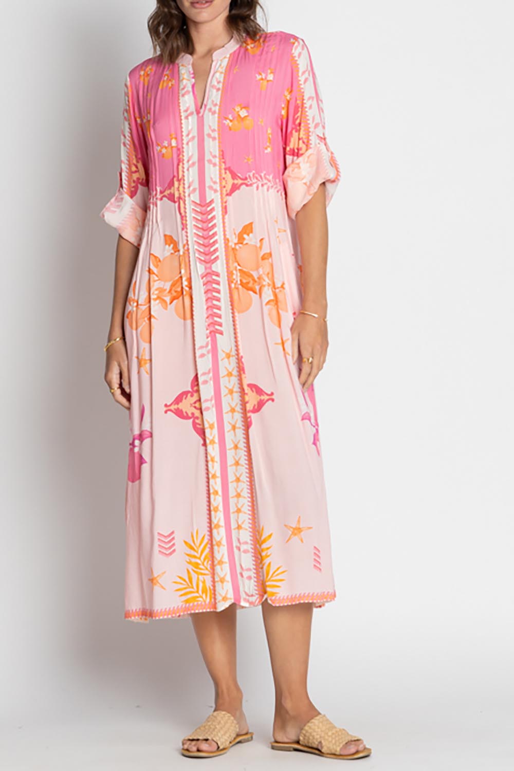 A model wearing the Espacio Midi Dress in colour Candy, from the front, cropped image