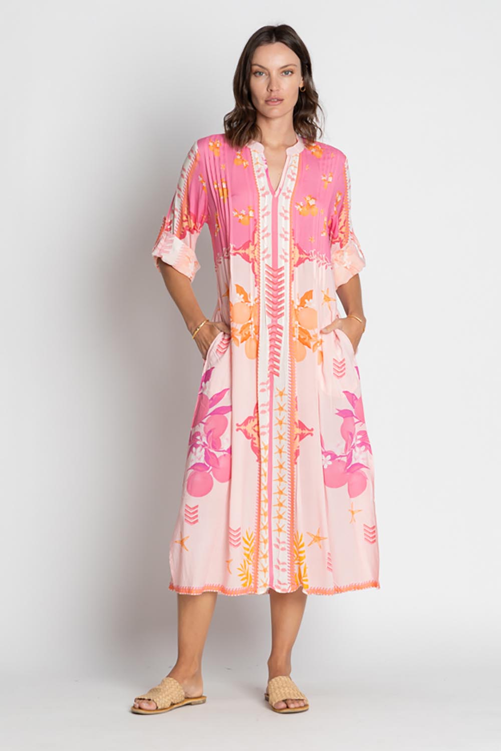 A model wearing the Espacio Midi Dress in colour Candy, from the front, showing the whole outfit