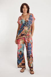 A model wearing the Fiesta Modal Blend Pant in colour Print, from the front, showing the whole outfit