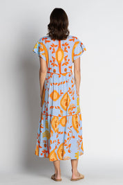 A model wearing the Juno Midi in colour Sky, from the back