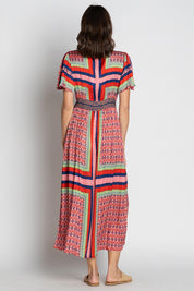 A model wearing the Legian Midi in colour Melon, from the back