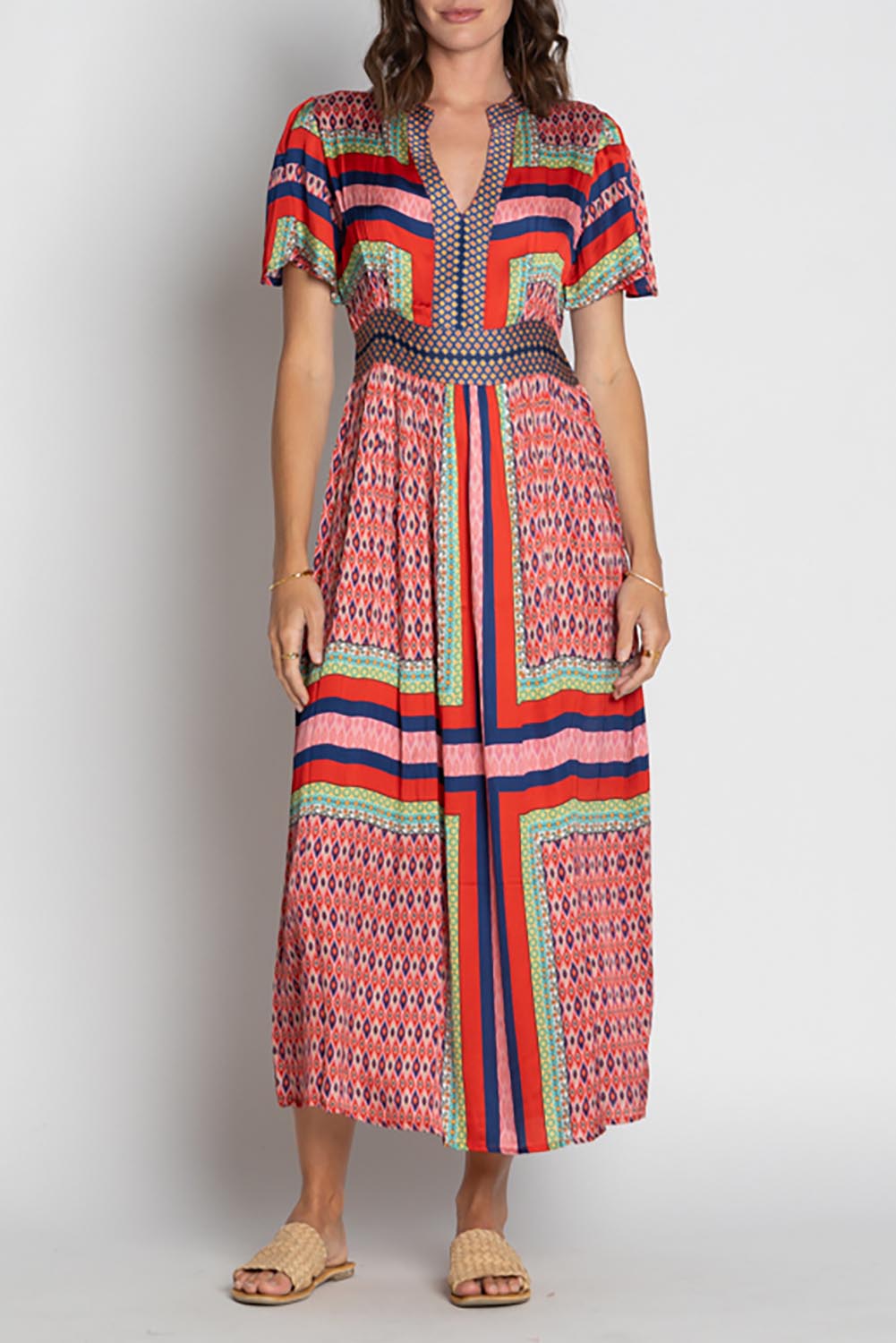 A model wearing the Legian Midi in colour Melon, from the front, cropped image