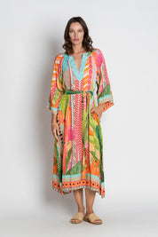 A model wearing the Los Cabos Midi Dress in colour Mist, from the front, showing the whole outfit