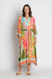 A model wearing the Los Cabos Midi Dress in colour Mist, from the front, showing the whole outfit