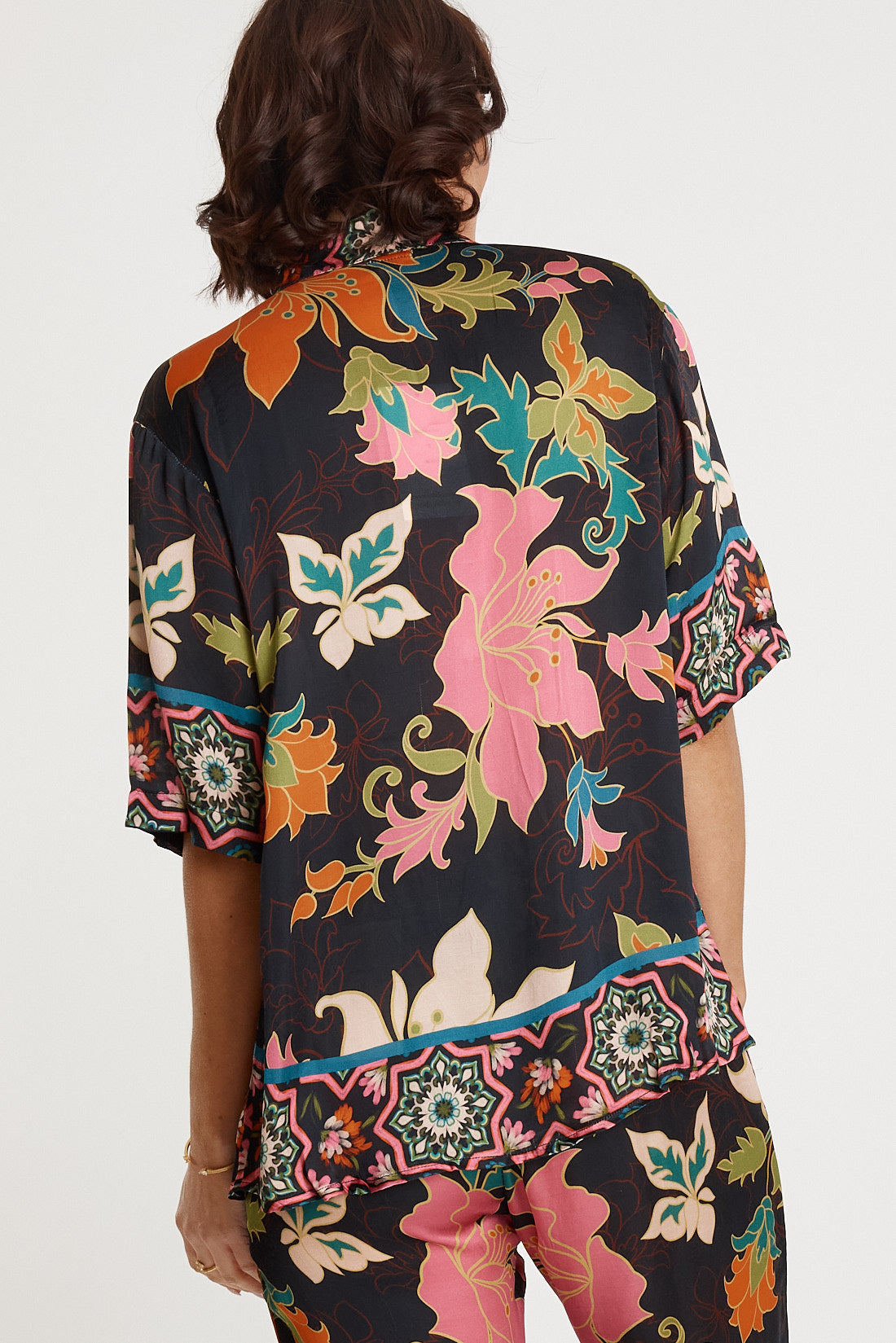 A model wearing the Marquis Modal Blend Top in colour Black (Black), from the back