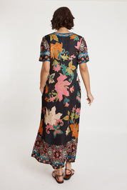 A model wearing the Marquis Modal Blend Midi Dress in colour Black (Black), from the back