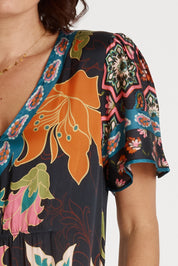 A model wearing the Marquis Modal Blend Midi Dress in colour Black (Black), from the front, cropped image