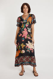 A model wearing the Marquis Modal Blend Midi Dress in colour Black (Black), from the front, showing the whole outfit