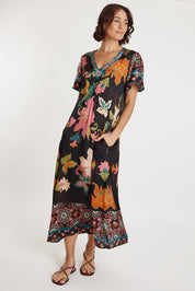 A model wearing the Marquis Modal Blend Midi Dress in colour Black (Black), from the front, showing the whole outfit