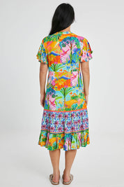 Model Katie wearing size S of the Mirage Dress in colour Print (Blue), from the back