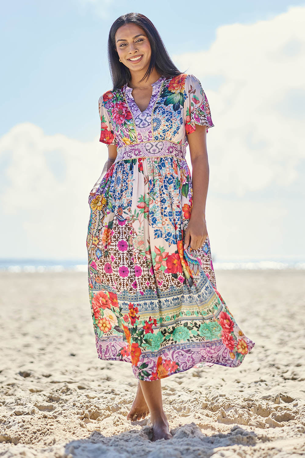 Model Eshan wearing size 10 of the Miraval Midi Dress – Lilac in colour Lilac, from the front