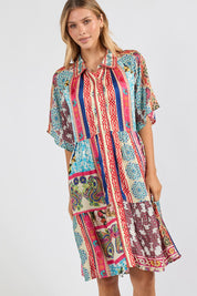 Model Genericm wearing size sample of the Miramar Dress – Print in colour Print, from an angle