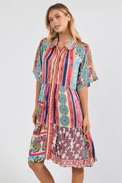 Model Genericm wearing size sample of the Miramar Dress – Print in colour Print, in a cropped view