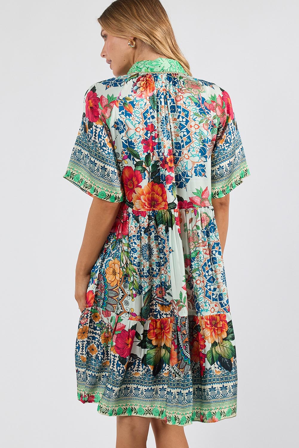 Model Genericm wearing size sample of the Miraval Dress – Mint in colour Mint, from the back