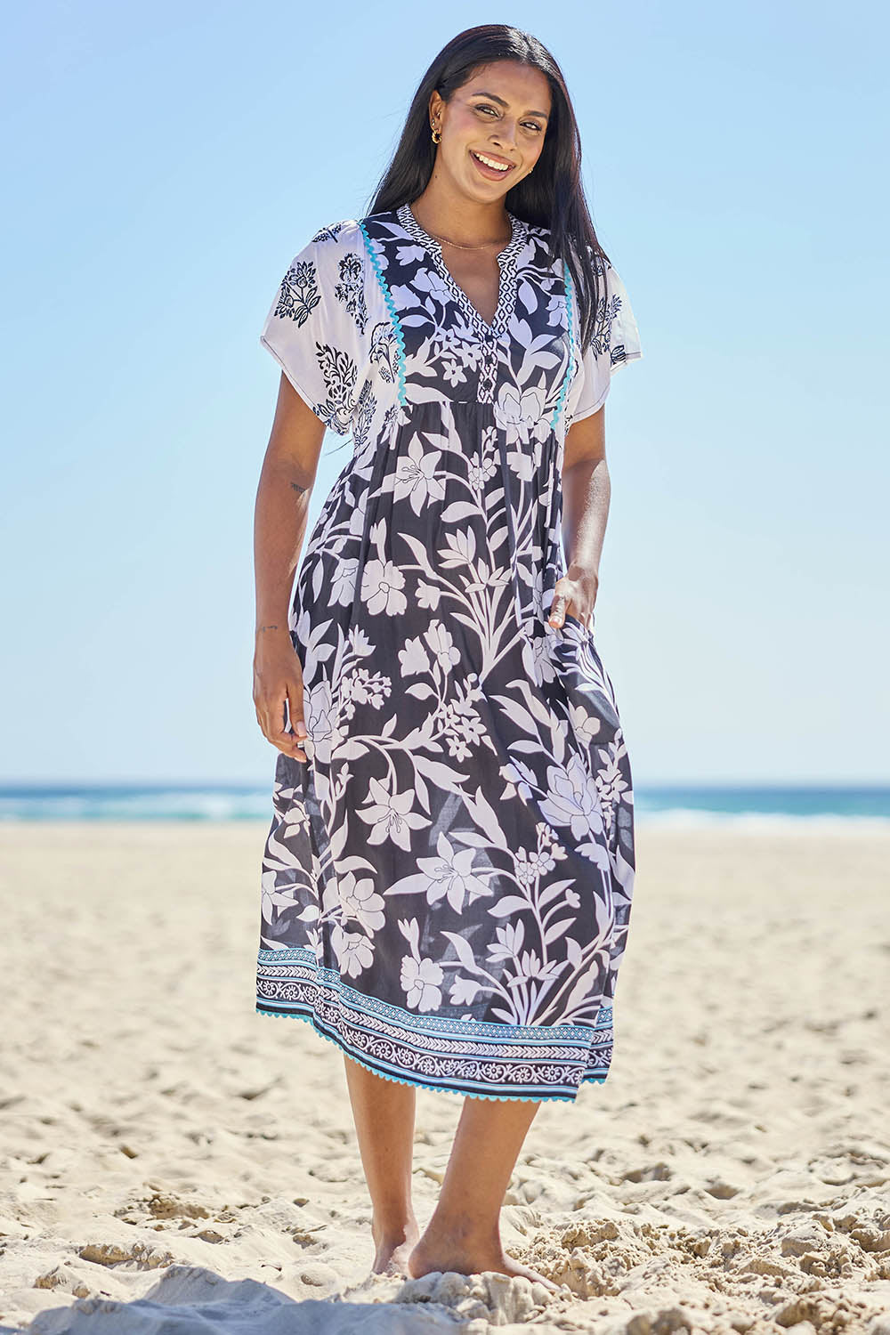 Model Eshan wearing size 10 of the Paloma Midi Dress - Print in colour Print, from the front