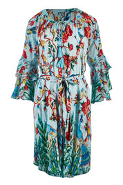 Product shot of the Peacock Dress in colour Mint (Blue), from the front