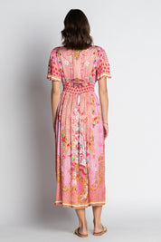 A model wearing the Pellicano Midi in colour Orchid (Pink), from the back