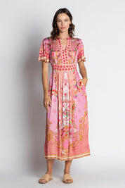 A model wearing the Pellicano Midi in colour Orchid (Pink), from the front, showing the whole outfit