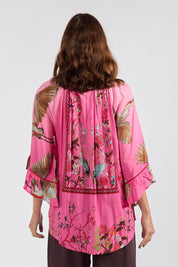 Model Genericm wearing size sample of the Sachiko Top – Fuchsia in colour Fuchsia, from the back