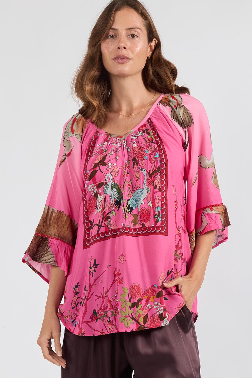 Model Genericm wearing size sample of the Sachiko Top – Fuchsia in colour Fuchsia, in a cropped view