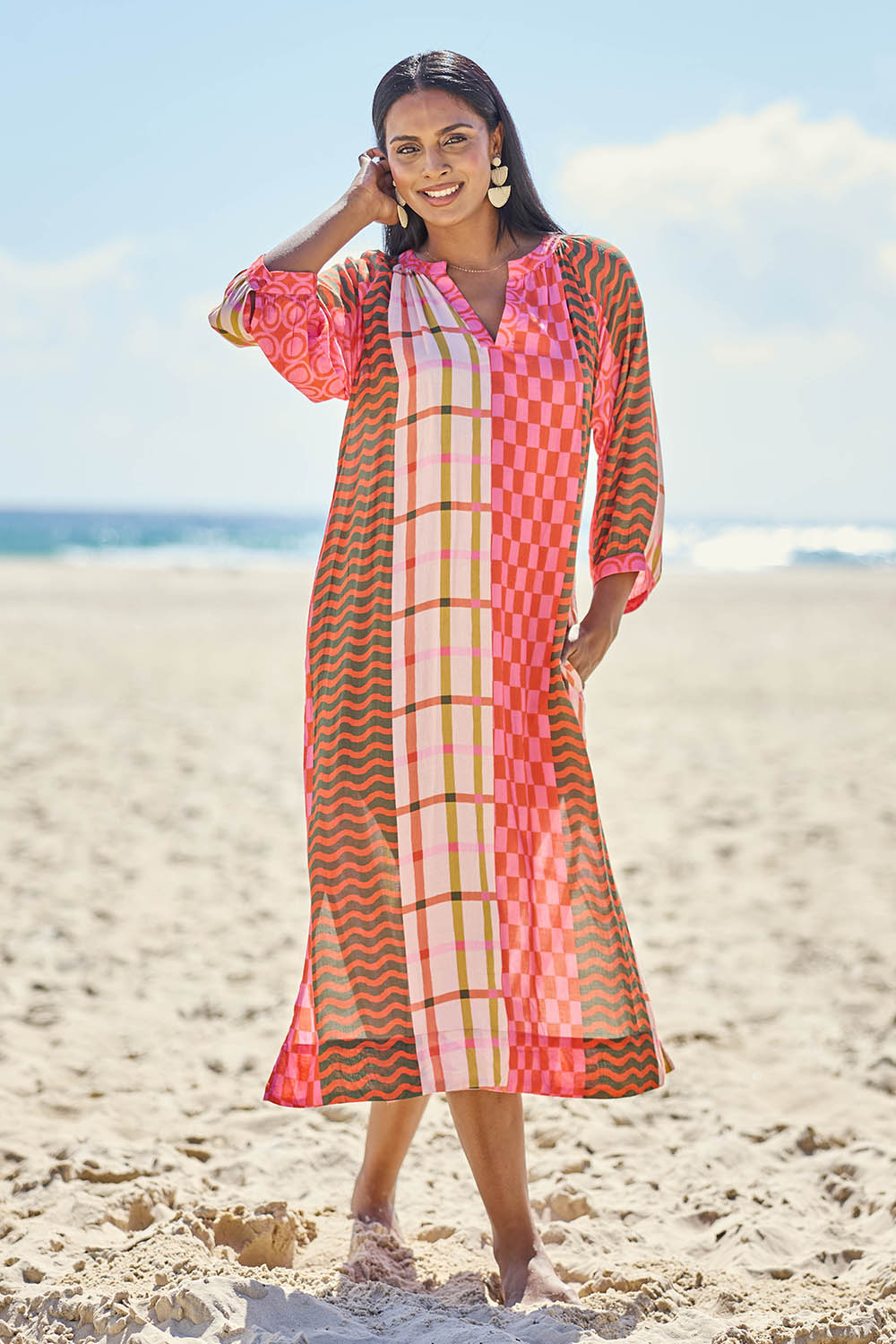 Model Eshan wearing size 10 of the Salina Midi Dress - Print in colour Print, from the front