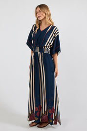 Model Genericm wearing size sample of the Sandos Maxi Dress – Navy in colour Navy, from the front