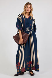 Model Genericm wearing size sample of the Sandos Maxi Dress – Navy in colour Navy, from the front