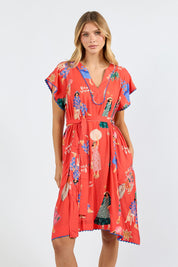 Model Genericm wearing size sample of the Summer Vibes Dress – Melon in colour Melon, in a cropped view