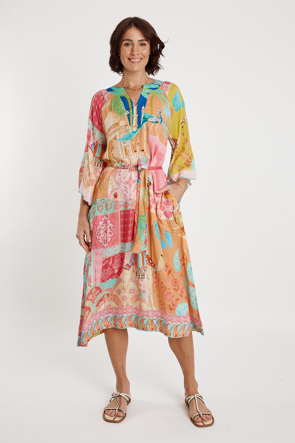 A model wearing the Taj Kaftan in colour Multi, from the front, showing the whole outfit