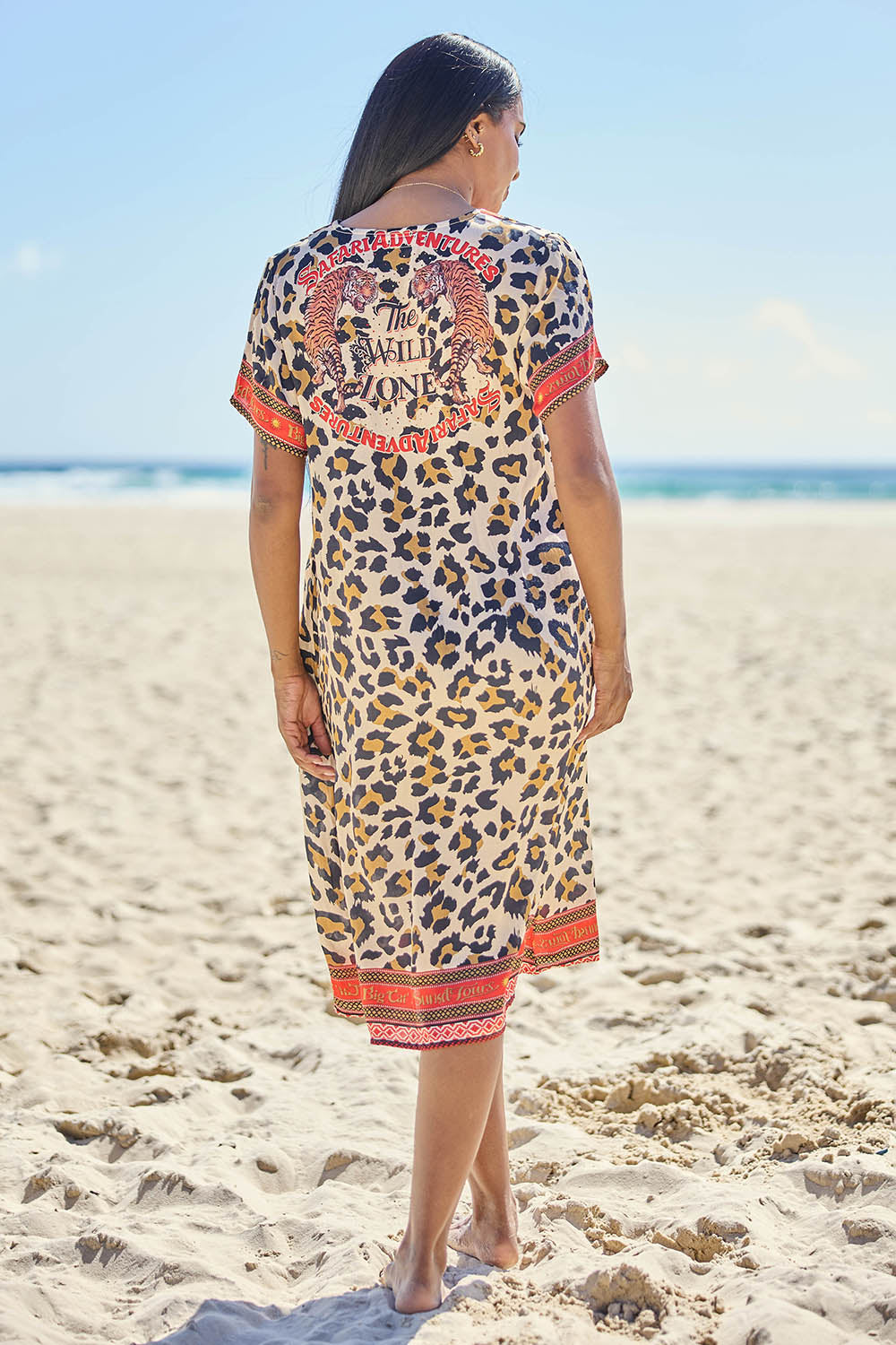 Model Eshan wearing size 10 of the Wild Safari Dress - Print in colour Print, from the front