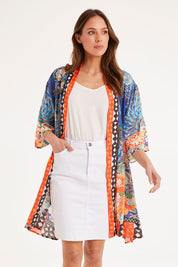 Model Madeline wearing size S of the Yoko Kimono in colour Navy (Blue), from the front, cropped image