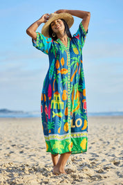 Model Eshan wearing size 10 of the Yolo Button Midi Dress – Navy in colour Navy, from the front