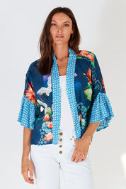 A model wearing the Yoshiko Bolero Jacket in colour Blue (Blue), from the front, cropped image